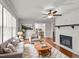 Living room with fireplace, hardwood floors, and comfy seating at 1117 Beechwood Dr, Rocky Mount, NC 27803