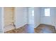 Clean bathroom with a tub shower, toilet and wood-look flooring at 1132 Middlecrest Dr, Rocky Mount, NC 27804