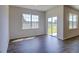 Dining area with hardwood floors, large windows, and sliding glass doors at 1132 Middlecrest Dr, Rocky Mount, NC 27804