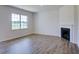 Spacious living room features hardwood floors and a corner fireplace at 1132 Middlecrest Dr, Rocky Mount, NC 27804