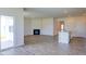 Open living room with hardwood floors, fireplace, and kitchen view at 1132 Middlecrest Dr, Rocky Mount, NC 27804