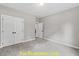 Spacious bedroom with double doors and carpet flooring at 116 Mohave Dr, Louisburg, NC 27549