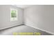 Bright and airy bedroom with carpeted floors and large window at 116 Mohave Dr, Louisburg, NC 27549