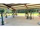 Covered outdoor fitness center with a variety of equipment at 116 Mohave Dr, Louisburg, NC 27549