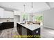 Eat-in kitchen, large island, white and dark cabinets, breakfast nook at 116 Mohave Dr, Louisburg, NC 27549