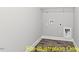 Bright laundry room with built-in shelving at 116 Mohave Dr, Louisburg, NC 27549