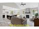 Open living room features a fireplace and flows into the kitchen at 116 Mohave Dr, Louisburg, NC 27549