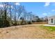 Large, unfenced backyard with potential for landscaping or outdoor activities and backs up to a wooded area at 1246 Jamestowne Dr, Elon, NC 27244