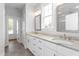 Bright bathroom with double sink vanity, modern light fixtures, and granite countertops at 1246 Jamestowne Dr, Elon, NC 27244