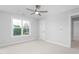 A bedroom featuring neutral walls, carpet floors, a ceiling fan, and a view of the neighborhood at 1246 Jamestowne Dr, Elon, NC 27244