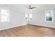 Spacious bedroom features a ceiling fan, two windows, and neutral walls at 1246 Jamestowne Dr, Elon, NC 27244
