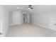 Bright bonus room with carpet floors, ceiling fan, neutral walls, and access to other rooms at 1246 Jamestowne Dr, Elon, NC 27244