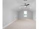 Spacious bonus room featuring neutral walls, carpet flooring, a ceiling fan, recessed lights, and a window at 1246 Jamestowne Dr, Elon, NC 27244