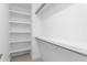 Bright walk-in closet features custom built-in shelving and ample storage space at 1246 Jamestowne Dr, Elon, NC 27244