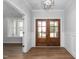 Bright foyer with hardwood floors and a stylish double-door entry at 1246 Jamestowne Dr, Elon, NC 27244