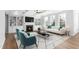Cozy living room with a fireplace, built-in shelves, and stylish furniture at 1246 Jamestowne Dr, Elon, NC 27244
