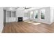 Elegant living area featuring built-in shelves, a fireplace, and large windows at 1246 Jamestowne Dr, Elon, NC 27244