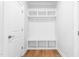 Bright mudroom with built-in shelving, coat hooks, and bench seating offers stylish storage space at 1246 Jamestowne Dr, Elon, NC 27244