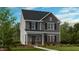 Two-story home with gray siding, brick accents, and landscaping at 1264 Hardin Hill Ln, Knightdale, NC 27545