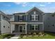 Charming two-story home with a brick foundation, covered porch and a well-manicured lawn at 1264 Hardin Hill Ln, Knightdale, NC 27545