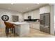Modern kitchen with white cabinets, an island, and stainless steel appliances at 1264 Hardin Hill Ln, Knightdale, NC 27545