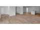 Spacious living room with hardwood floors, connecting to the kitchen and other rooms at 1264 Hardin Hill Ln, Knightdale, NC 27545