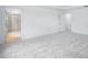 Spacious bedroom with plush carpeting, attached bath, and large windows at 1264 Hardin Hill Ln, Knightdale, NC 27545