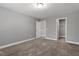 Upstairs bedroom with two closets and grey carpet at 136 Carissa Drive Dr, Smithfield, NC 27577