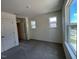 Bright bedroom with two large windows, closet, and neutral gray carpet at 136 Parker Ln, Mebane, NC 27302