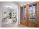 Bright and spacious entryway with hardwood floors and a view to office at 139 Quail Pt, Pittsboro, NC 27312