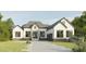 Modern two-story house with a welcoming front porch and driveway at 139 Quail Pt, Pittsboro, NC 27312