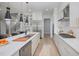 Modern kitchen boasts stainless steel appliances and a large island at 139 Quail Pt, Pittsboro, NC 27312