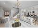 Open living room with a staircase, and views into the kitchen at 139 Quail Pt, Pittsboro, NC 27312