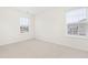 Spacious bedroom with neutral carpeting and large windows at 1701 Mallard Trace Dr, Wendell, NC 27591