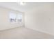 Bright bedroom with neutral carpeting and two windows at 1701 Mallard Trace Dr, Wendell, NC 27591