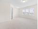 Bright bedroom featuring carpet and large windows at 1701 Mallard Trace Dr, Wendell, NC 27591