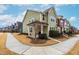 Two-story townhome showcasing a side view and landscaped yard at 1701 Mallard Trace Dr, Wendell, NC 27591