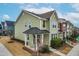 Two-story townhome with a metal roof and charming porch at 1701 Mallard Trace Dr, Wendell, NC 27591