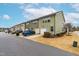 Townhouse exteriors with garages and landscaping at 1701 Mallard Trace Dr, Wendell, NC 27591