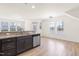 Modern kitchen with dark cabinetry, granite counters, and stainless steel appliances at 1701 Mallard Trace Dr, Wendell, NC 27591