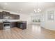 Open concept kitchen with an island, hardwood floors, and plenty of natural light at 1701 Mallard Trace Dr, Wendell, NC 27591