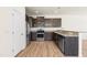 L-shaped kitchen with stainless steel appliances and granite countertops at 1701 Mallard Trace Dr, Wendell, NC 27591