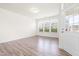 Bright living room featuring hardwood floors and large windows at 1701 Mallard Trace Dr, Wendell, NC 27591