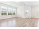 Light-filled living room with hardwood floors and exterior access at 1701 Mallard Trace Dr, Wendell, NC 27591
