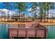 Wooden dock overlooking a serene pond at 1701 Mallard Trace Dr, Wendell, NC 27591