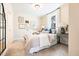 Comfortable bedroom featuring a cozy bed, neutral tones, and stylish decor at 201 Broomgrove Way, Wake Forest, NC 27587