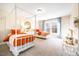 Bright bedroom featuring two canopy beds, soft carpeting, and abundant natural light from the large window at 201 Broomgrove Way, Wake Forest, NC 27587