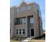New construction townhouse with brick and siding, balcony, and manicured landscaping at 201 Broomgrove Way, Wake Forest, NC 27587