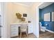 Charming home office space featuring a built-in desk and storage, complemented by a view into the bathroom at 201 Broomgrove Way, Wake Forest, NC 27587