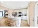 Modern kitchen with white cabinets, stainless steel appliances, an island and barstool seating at 201 Broomgrove Way, Wake Forest, NC 27587